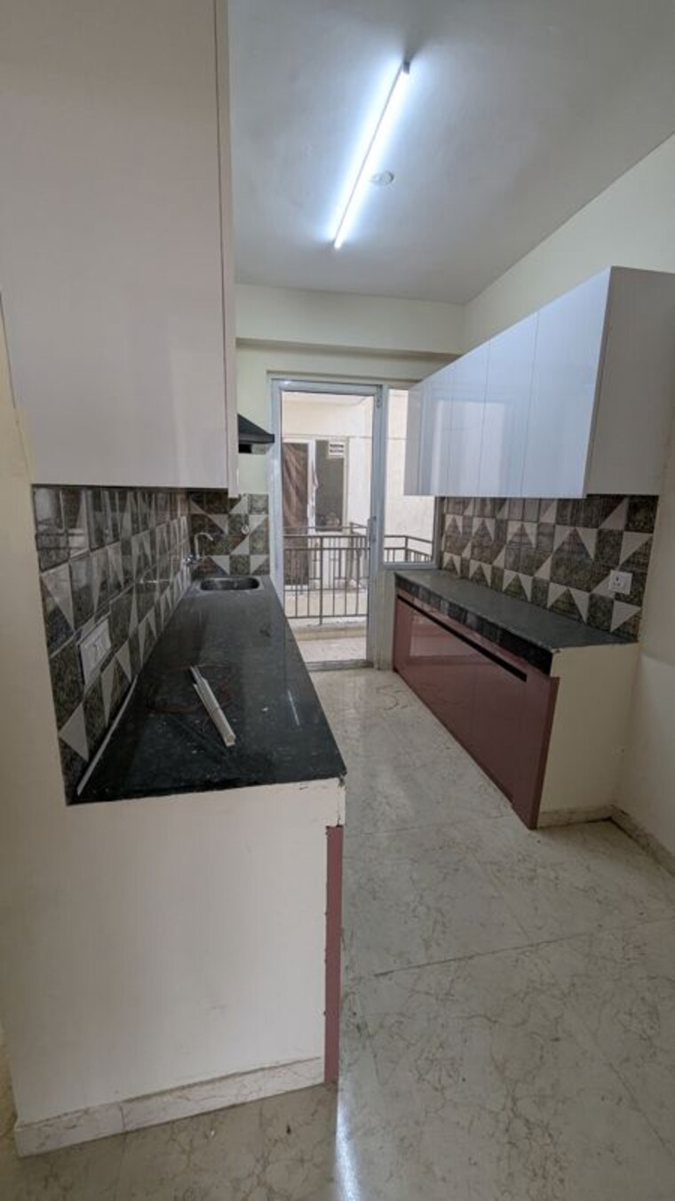 Kitchen, signature-global-proxima-phase-2 2 Bedroom 65 Sq.Yd. Apartment In Sector 89 Gurgaon 10521339