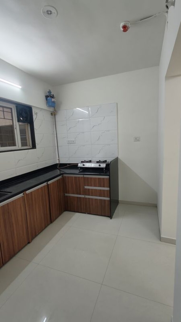 Kitchen, sukhwani-skylines 2 Bedroom 733 Sq.Ft. Apartment In Wakad Pune 10521439