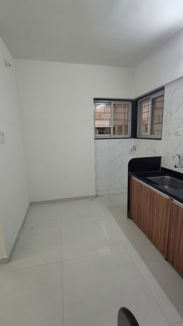 Kitchen, sukhwani-skylines 2 Bedroom 733 Sq.Ft. Apartment In Wakad Pune 10521439