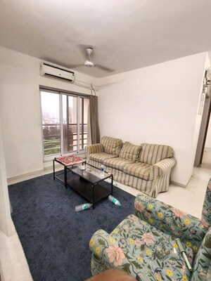 Living Room in 2 BHK Apartment at Romell Amore, Andheri West – for Rent