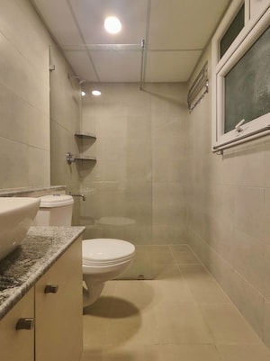 Bathroom in  Apartment at Bhartiya Nikoo Homes Phase 2, Thanisandra Main Road – for Rent