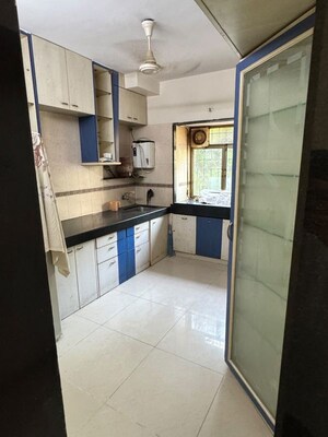 Kitchen in 2 BHK Apartment at Gokul Divine CHS, Vile Parle West – for Rent