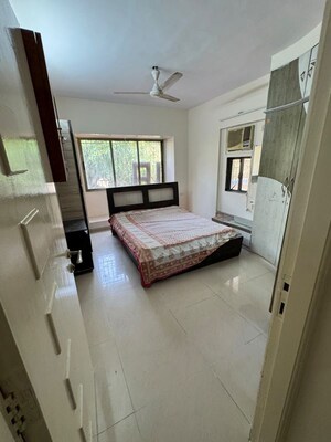 Living Room in 2 BHK Apartment at Gokul Divine CHS, Vile Parle West – for Rent