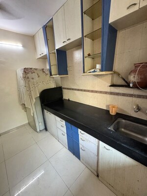 Kitchen in 2 BHK Apartment at Gokul Divine CHS, Vile Parle West – for Rent