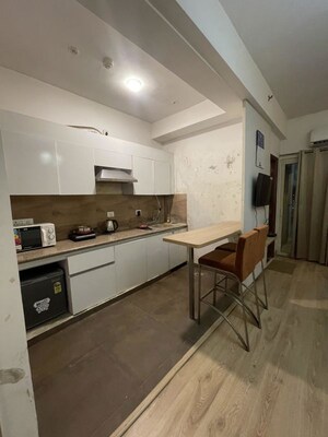 Kitchen in 1 BHK Apartment at Nimbus The Golden Palm, Sector 168 – for Sale