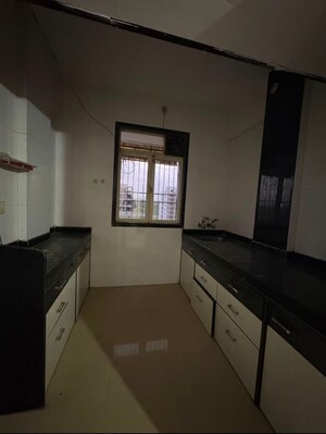 Kitchen in 1 BHK Apartment at RV Waman Heights, Dombivli West – for Rent
