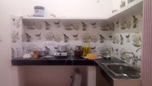 Kitchen in 1 BHK Apartment at Rupa Residency Noida, Sector 73 – for Sale