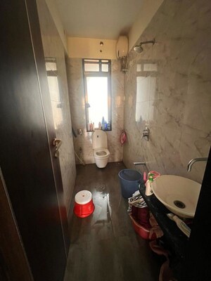 Bathroom in 2 BHK Apartment at Wisemen Fressia Rainbello, Malad East – for Rent
