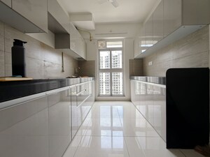 Kitchen in 3 BHK Apartment at Godrej Emerald, Ghodbunder Road – for Rent