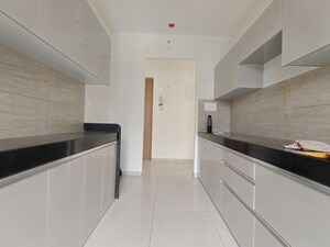Kitchen in 3 BHK Apartment at Godrej Emerald, Ghodbunder Road – for Rent