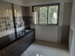 Kitchen in 2 BHK Apartment at Dahanukar Colony – for Sale