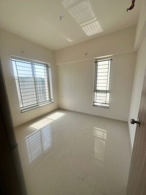 Room in 2 BHK Apartment at Kolte Patil Little Earth, Kiwale – for Rent