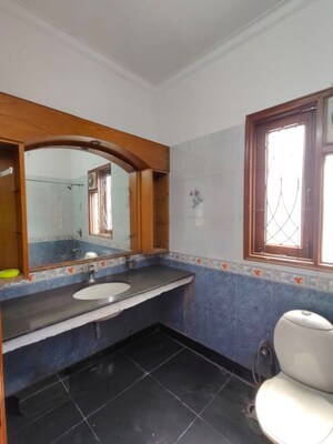Bedroom in 3 BHK Builder Floor at Nehru Enclave – for Rent