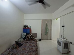 Living Room in 1 RK Apartment at Snowdrop CHS, Borivali West – for Rent