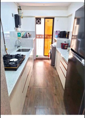 Kitchen in 2 BHK Apartment at Svarna Rosemary, Mahim West – for Rent
