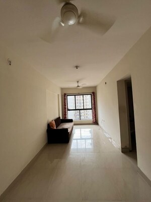 Living Room in 1 BHK Apartment at Lodha Golden Dream, Dombivli East – for Rent
