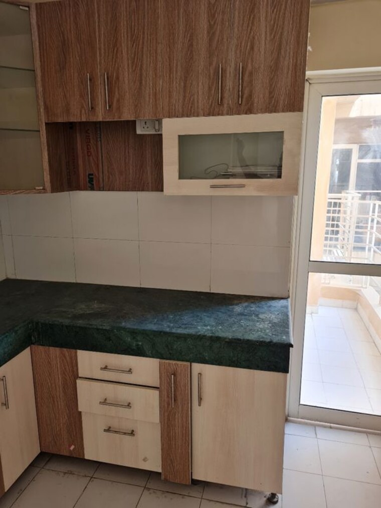 Kitchen, paras-tierea 2 Bedroom 1070 Sq.Ft. Apartment In Sector 137 Noida 10526969
