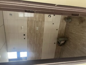 Bathroom in 2 BHK Apartment at Charms Castle, Raj Nagar Extension – for Sale