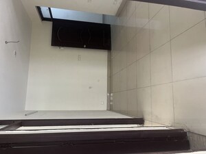 Kitchen in 2 BHK Apartment at Charms Castle, Raj Nagar Extension – for Sale