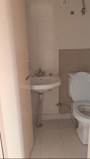 Bathroom in 3 BHK Apartment at Charms Castle, Raj Nagar Extension – for Sale