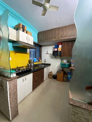 Kitchen in 2 BHK Apartment at Mohan Regency, Kalyan West – for Sale