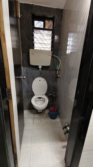 Bathroom in 1 BHK Apartment at Asmita Jyoti CHS, Malad West – for Rent