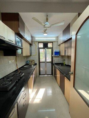 Kitchen in 2 BHK Apartment at Mukta Apartment 10th Main, Khar West – for Rent