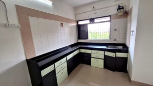 Kitchen in 2 BHK Apartment at Cosmos Heritage, Manpada – for Rent