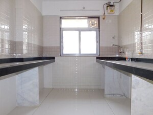 Kitchen in 2 BHK Apartment at Omkar CHS Mulund, Mulund East – for Sale