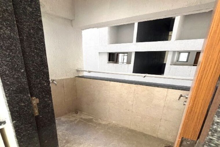 Kitchen, gera-planet-of-joy 2 Bedroom 792 Sq.Ft. Apartment In Kharadi Pune 10529478