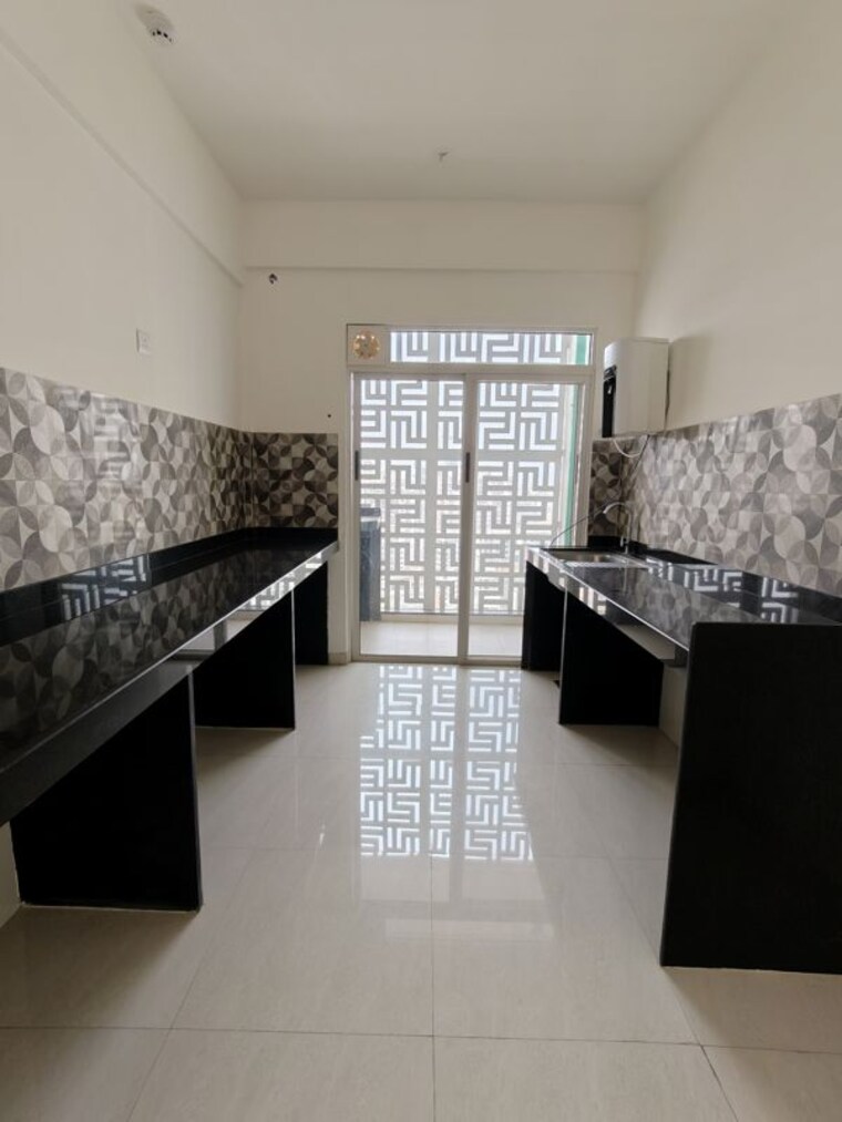 Kitchen, lodha-bella-vita 3 Bedroom 1056 Sq.Ft. Apartment In Nibm Road Pune 10529549