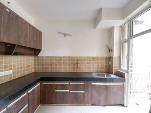 Kitchen in 2 BHK Apartment at Mahagun Mywoods, Sector 16c Greater Noida – for Rent