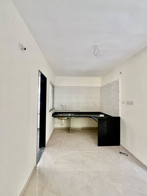 Building Lobby in 2 BHK Apartment at Whistling Winds, Pisoli – for Sale