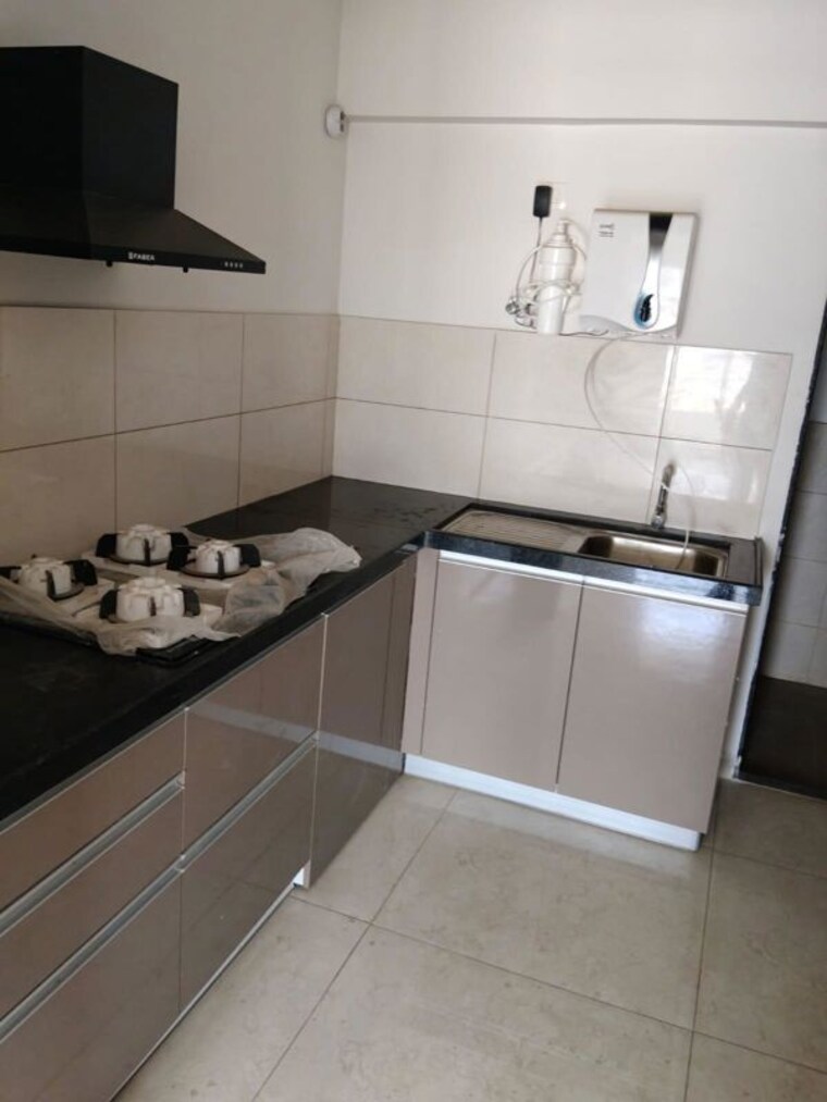 Kitchen, gera-world-of-joy 2 Bedroom 850 Sq.Ft. Apartment In Kharadi Pune 10531172