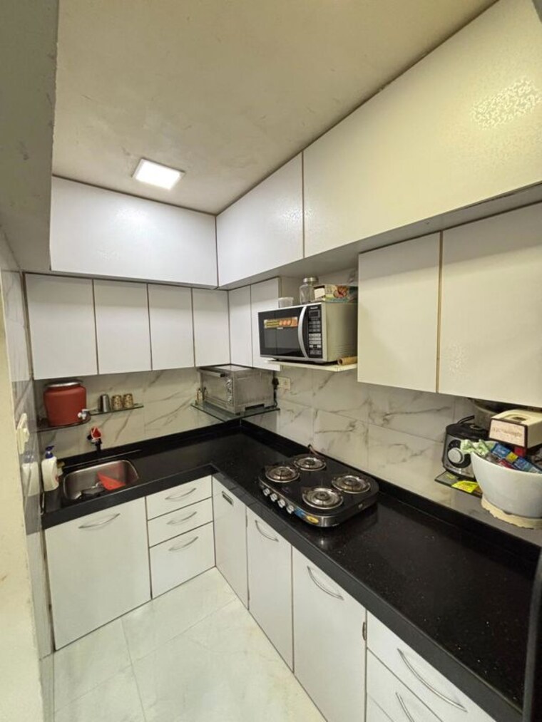 Kitchen, olympia-tower 2.5 Bedroom 750 Sq.Ft. Apartment In Jacob Circle Mumbai 10533801