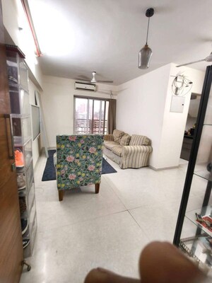 Living Room in 2 BHK Apartment at Romell Amore, Andheri West – for Rent