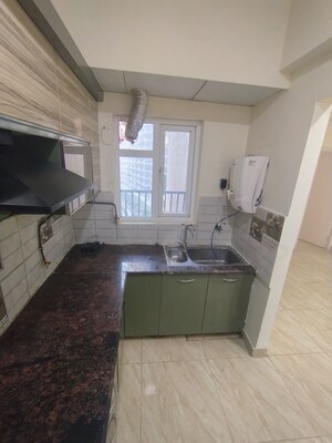 Kitchen in 2 BHK Apartment at Gaur City 2 - 14th Avenue, Sector 16c Greater Noida – for Rent