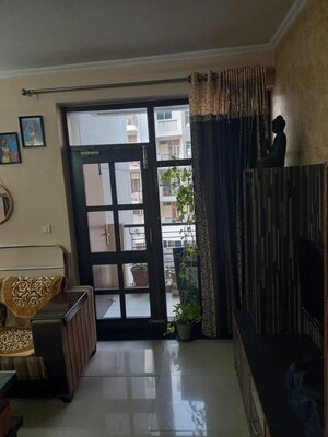 Living Room in 2 BHK Apartment at Omaxe New Heights, Sector 78 – for Rent