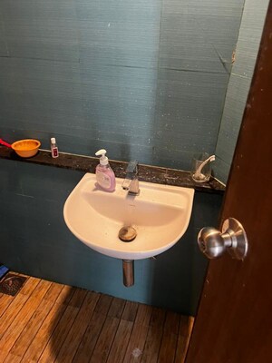 Bathroom in 1 BHK Apartment at Lodha Quality Home Tower 5, Majiwada – for Rent