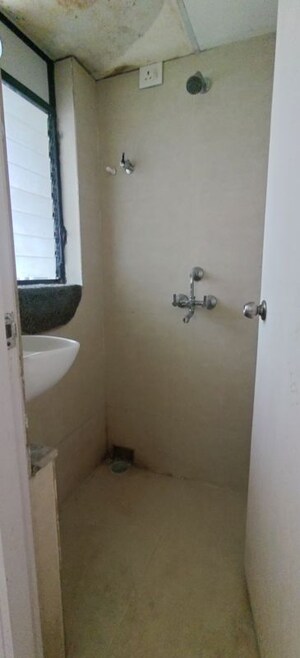 Bathroom in 2 BHK Apartment at Runwal Gardens North Avenue, Dombivli East – for Rent