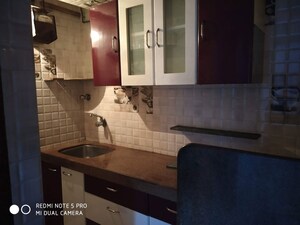 Kitchen in 1 BHK Apartment at Gokuldham Complex, Goregaon East – for Sale