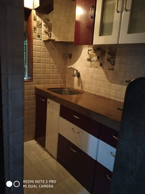 Kitchen in 1 BHK Apartment at Gokuldham Complex, Goregaon East – for Sale