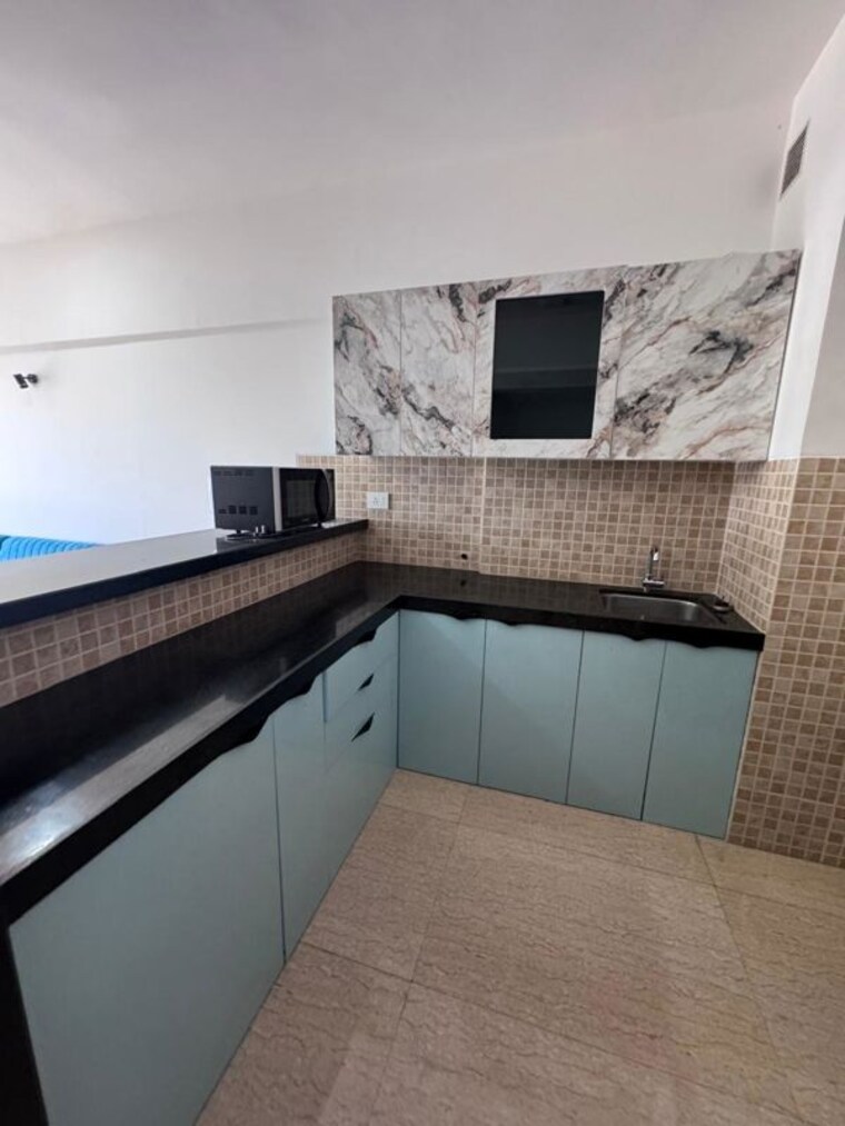 Kitchen, lodha-belmondo 1 Bedroom 490 Sq.Ft. Apartment In Gahunje Pune 10535009