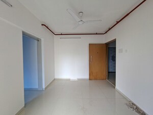 Living Room in 2 BHK Apartment at Romell Serene, Borivali West – for Sale