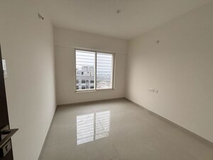 Room in 2 BHK Apartment at Kolte Patil Little Earth, Kiwale – for Sale
