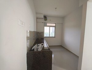Kitchen in 1 BHK Apartment at Metropolis Bayside, Kasarvadavali – for Rent