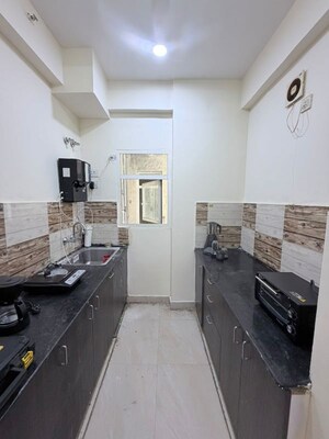Kitchen in 2.5 BHK Apartment at Gaur City 6th Avenue, Sector 4 Greater Noida – for Rent