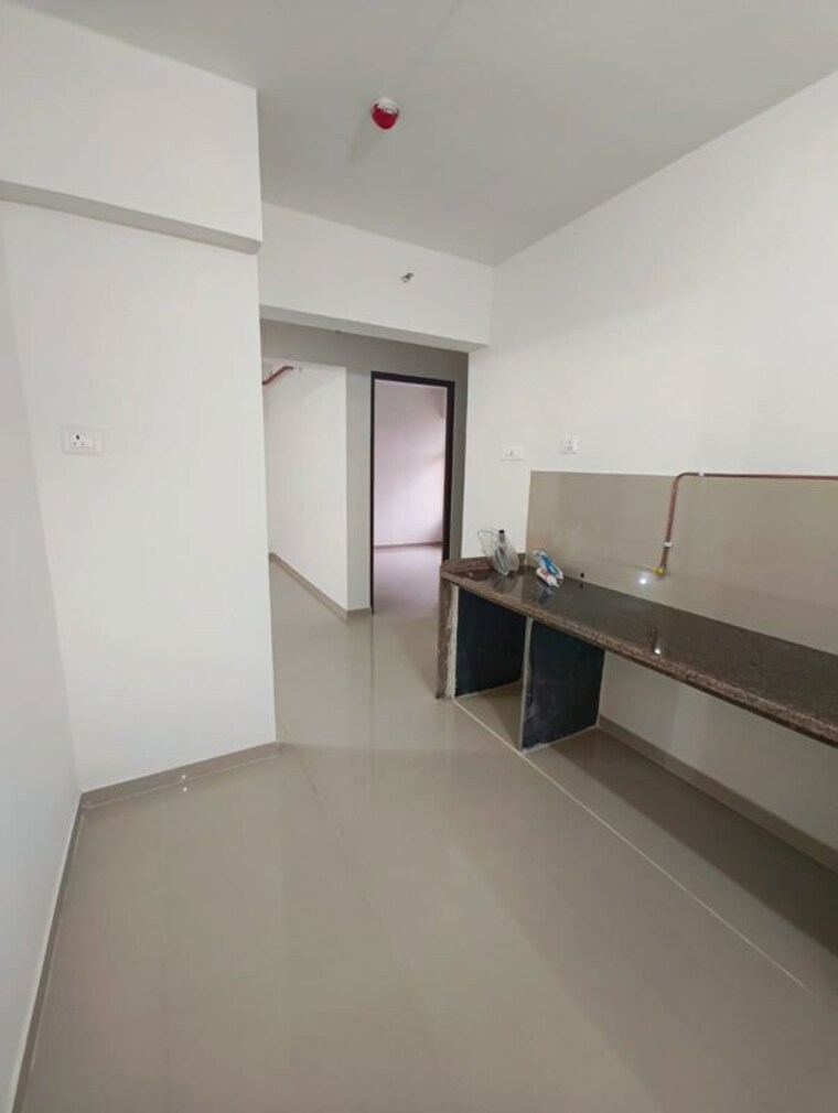 Kitchen, godrej-emerald 2 Bedroom 600 Sq.Ft. Apartment In Ghodbunder Road Thane 10537101