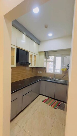 Kitchen in 2 BHK Apartment at Gaur City 2 - 12th Avenue, Sector 16c Greater Noida – for Rent