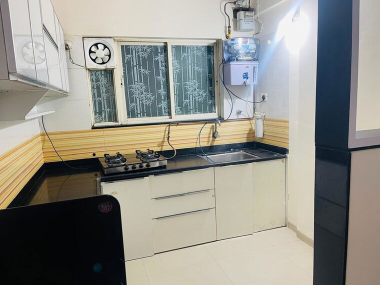 Kitchen, swiss-county 3 Bedroom 975 Sq.Ft. Apartment In Thergaon Pune 10537353